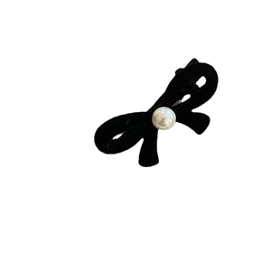 Elegant black velvet bow hair clip featuring a white faux pearl center for women