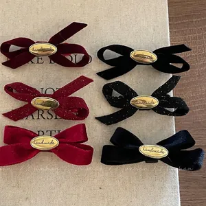 Velvet and glitter bow hair clip set with handmade gold charms in red and black