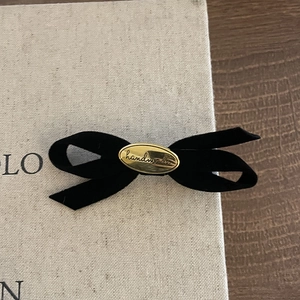 Elegant black velvet bow hair clip with a gold handmade engraved metal plate