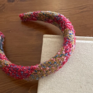 Detail showing the thick textured knit patterns of this colorful vintage style headband