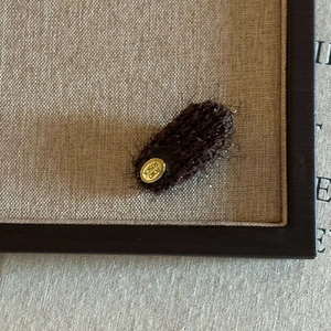 Plush dark brown oval hair clip for women with gold POKO FOSCA metal logo detail