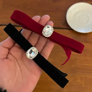 Elegant velvet bow hair clips in burgundy and black with large faux gemstone details
