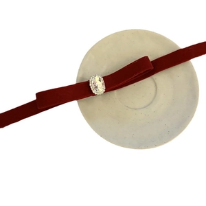Elegant wine red velvet choker with an oval crystal centerpiece and rhinestone border