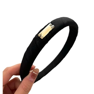 Elegant high-top black padded headband with golden rhinestone heart ornaments for women