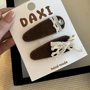 Brown velvet hair clips set with white lace bows and crystal accents for girls
