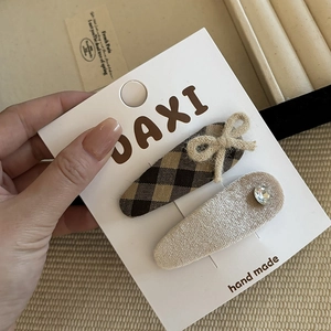 Handmade brown plaid bow hair clip and grey velvet barrette with rhinestone on display card