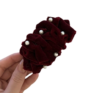 Velvet hair clip with pearls in wine red color shown on a clean white background