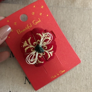Traditional Chinese red plush hair clip with golden embroidery for Year of the Dragon