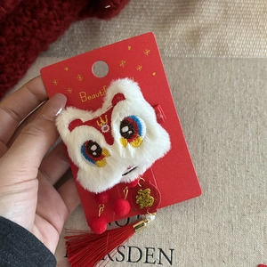 Cute plush lion hair clip with red tassels and Chinese Fu charm for New Year