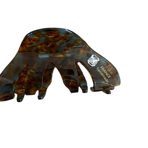 Elegant tortoise shell acetate hair claw clip with crystal inlay on white background