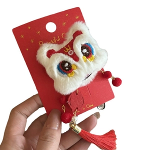 Cute plush lion dance hair clip with red tassels and pearls for Chinese New Year