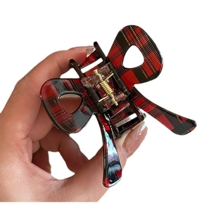 Classic red plaid bow hair claw clip with vintage pattern and gold metal spring closure