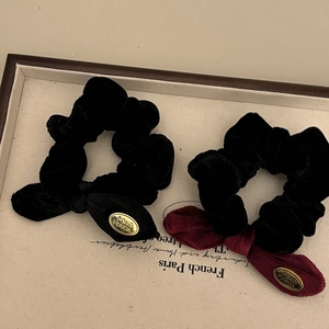 Elegant velvet bow scrunchies in black and wine red with gold metal tags set