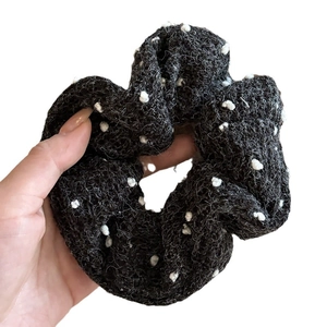 Black knitted polka dot hair scrunchie accessory for ponytail and bun hairstyles