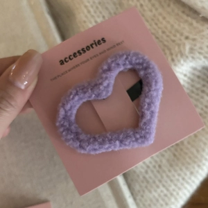 Sweet pink plush heart-shaped hair clip with lamb wool texture on display card