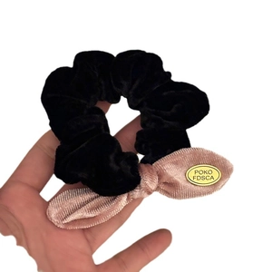 Elegant velvet bow hair scrunchie in black and pink with a gold metal emblem