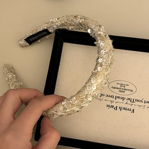 Detailed view of handmade velvet sequin headband with premium tweed texture
