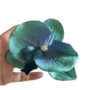Blue orchid hair clip with gradient silk petals and a pearl center for elegant styling
