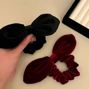 Elegant velvet bow hair scrunchies in black and wine red for retro style hairstyles