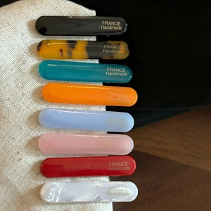 Detail of 8pcs colorful acetate hair clips set with gold France Handmade lettering