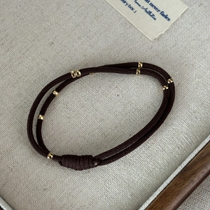 Minimalist dark brown elastic hair tie with polished gold beads for women hair styling