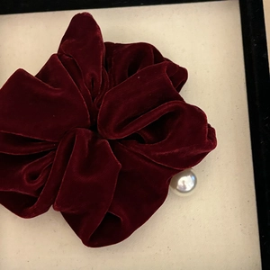 Elegant wine red velvet scrunchie with pearl detail for high ponytail hairstyles