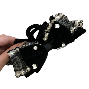 Elegant black velvet bow hair clip with white lace trim and sparkling rhinestones