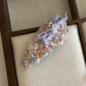Pink tweed bow hair clip with lace detail and gold buckle in vintage elegant style