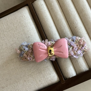 Pink resin bow hair clip with lovely lettering and pastel tweed fabric texture on base
