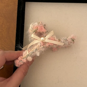 Pink and white plush hair claw clip with cream ribbon bow and pearl bead accent