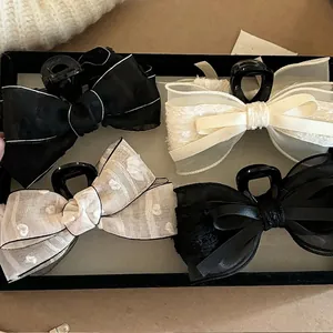 Elegant set of 4 silk bow hair claws in black and cream lace with floral embroidery