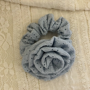 Light blue rose hair scrunchie with hollow embroidery detail on white lace background