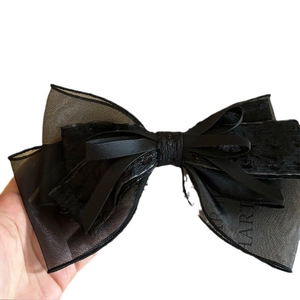 Elegant oversized black lace and silk satin bow hair clip with chic alphabet printed mesh