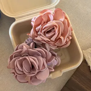 Large satin rose hair claw clips in vintage pink and dusty purple for elegant styling
