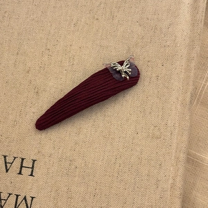 Purple gauze butterfly hair clip with burgundy ribbed fabric and silver metal accents