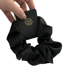 Elegant black tulle scrunchie with floral flocking and pearls for ponytail hairstyles