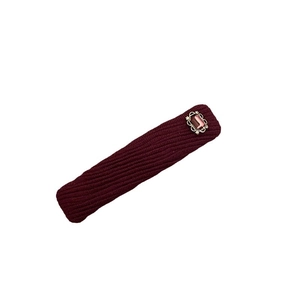 Elegant deep red knitted hair clip with pink gemstone and silver vintage floral frame