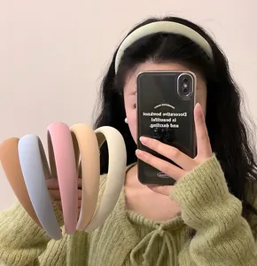 Detail of candy-colored sponge padded headband in various pastel shades for hair volume