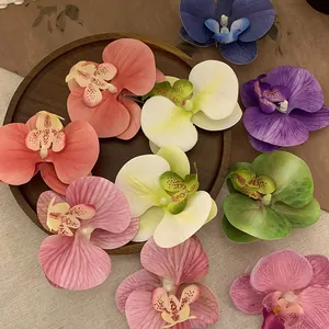 Detailed macro view of artificial orchid flower heads in various vibrant colors