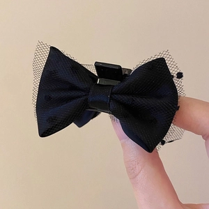 Elegant black satin and polka dot lace bow hair claw clip for a princess hairstyle