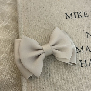 Elegant double-layered champagne bow hair clip with textured fabric for women