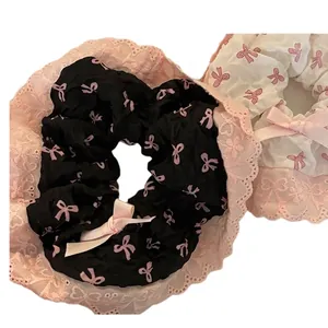 Haargummi-Set mit rosa Schleifen und Spitze in Schwarz und Creme für süßen Stil