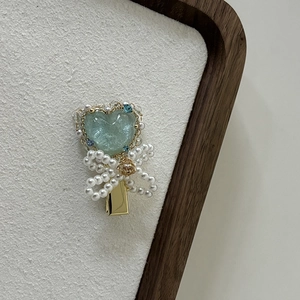 Elegant mint heart hair clip with pearl bow and blue crystal on gold base for women