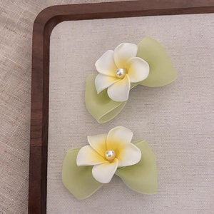 Set of two plumeria flower hair clips with pearl accent and green leaf base decoration
