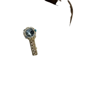 Vintage style square blue gemstone ring with white diamonds in gold finish