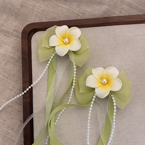 Frangipani hair clip with green chiffon bow and long pearl tassels for summer