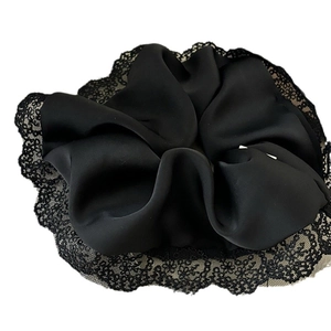 Elegant large black satin scrunchie with romantic lace edge detailing for women