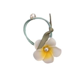 Green elastic hair tie with white plumeria flower, pearl accents and soft silk ribbon