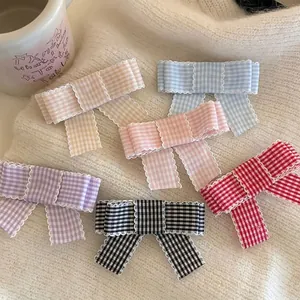 Set of six sweet plaid bow hair clips with white lace trim in various colors