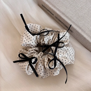 Polka dot scrunchie with velvet bows in cream and black for elegant hairstyles